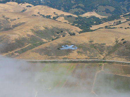 Navion over the fog