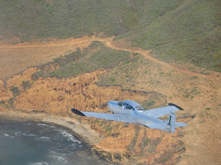 Navion and rugged shore